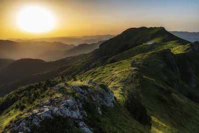 Scenic view of mountains against sky during sunset