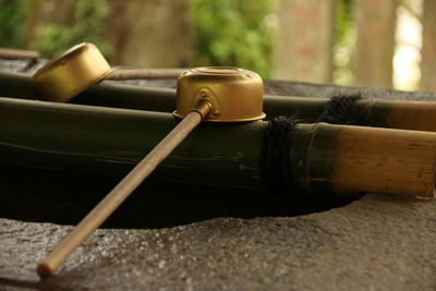 Close-up of spoon on bamboo