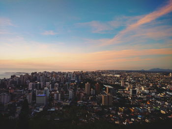 Cityscape against sky during sunset