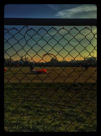 Chainlink fence seen through chainlink fence