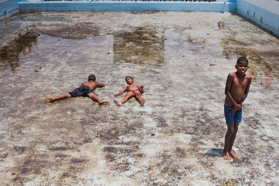 Full length of a friends enjoying in water