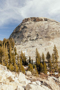 Low angle view of rock formations against sky