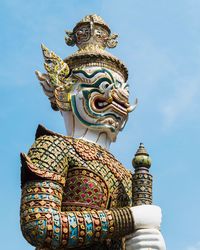 Low angle view of statue against sky