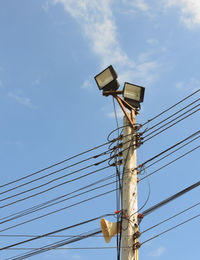 Low angle view of power line against sky