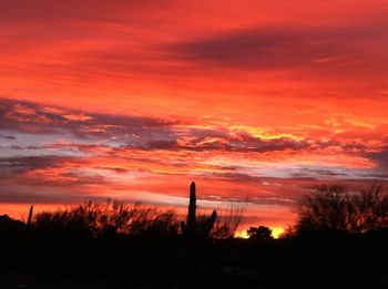 Scenic view of dramatic sky at sunset