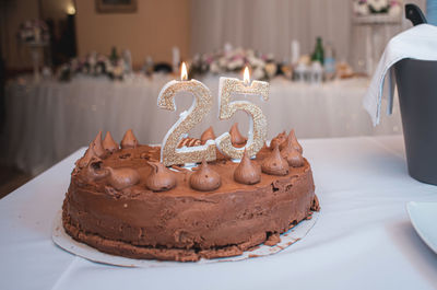 25th anniversary cake with candles