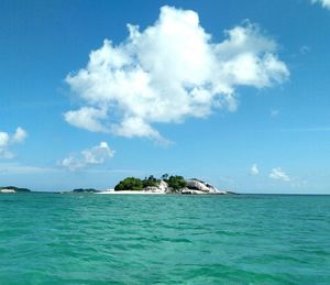 Scenic view of sea against blue sky