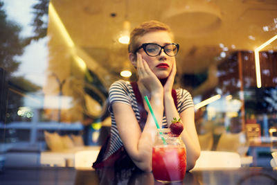 Young woman sitting at cafe