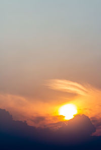 Low angle view of dramatic sky during sunset