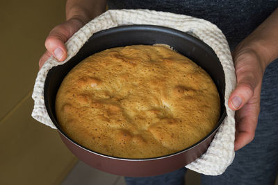 Close-up of hand holding ice cream
