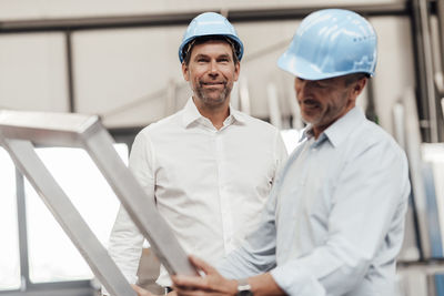 Man working with arms raised