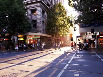 People on road in city