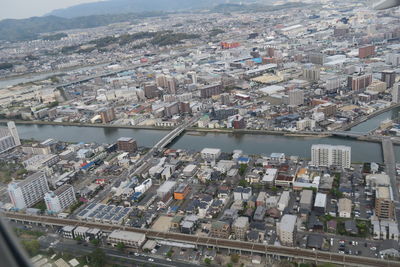 High angle view of crowd and buildings in city