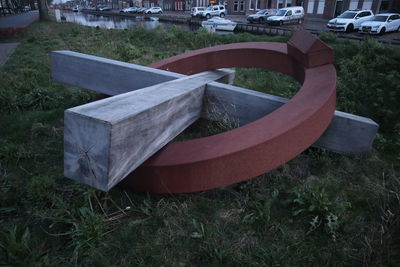 High angle view of empty bench on field