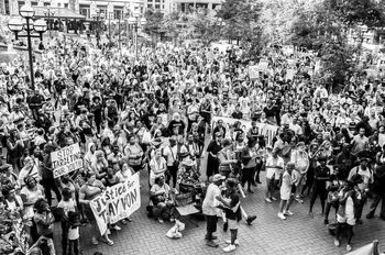 HIGH ANGLE VIEW OF CROWD WALKING ON STREET