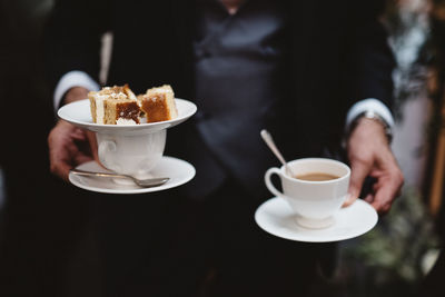 Close-up of coffee cup and cappuccino