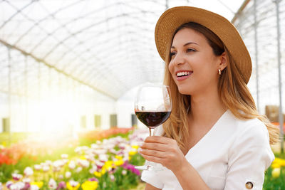Happy woman holding wineglass