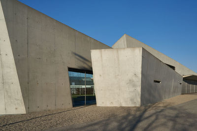 Low angle view of building against blue sky