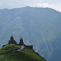 Castle on mountain against sky