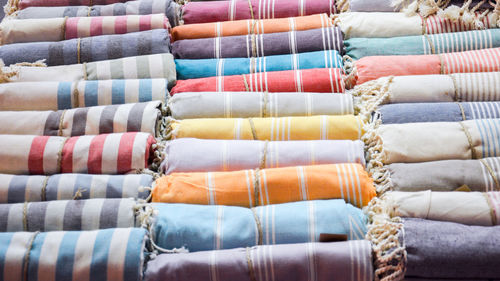 Full frame shot of rolled up fabrics at store