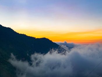 Scenic view of mountains against sky during sunset