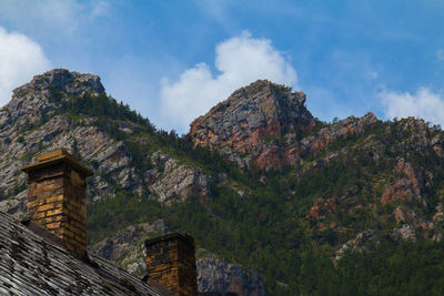 Low angle view of rocks against sky