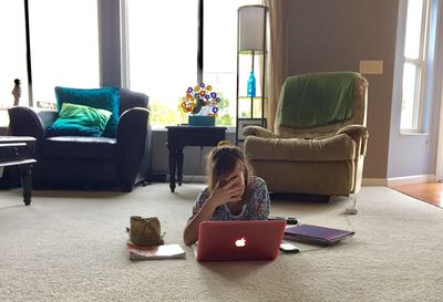 Girl sitting on sofa