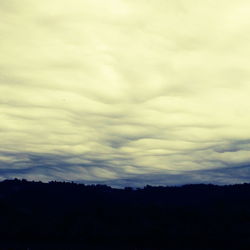 Scenic view of landscape against cloudy sky