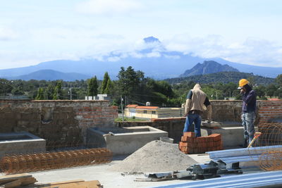 Woman with mountains in background