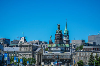 Buildings against blue sky