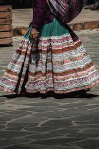 Low section of woman standing outdoors