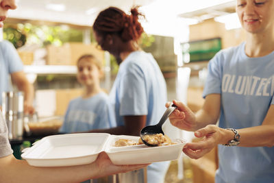 Midsection of woman having food