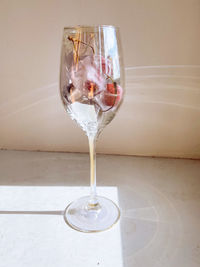 Close-up of wineglass on table