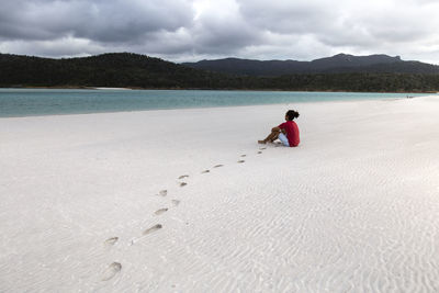 Full length of man on beach against sky