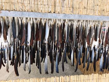 Clothes drying on wood against wall