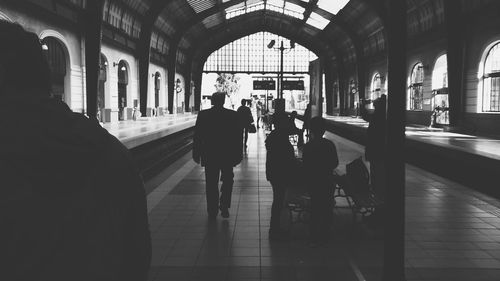 People walking at railroad station