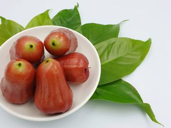 High angle view of fruits in plate on table