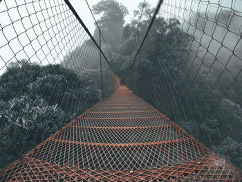 Footbridge over chainlink fence