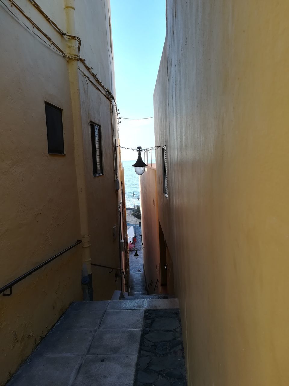 NARROW ALLEY AMIDST BUILDINGS