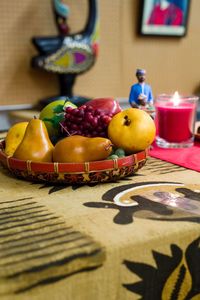 Close-up of fruits in basket on table