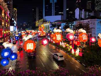 High angle view of people in city at night