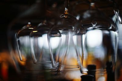 Close-up of upside down wine glasses