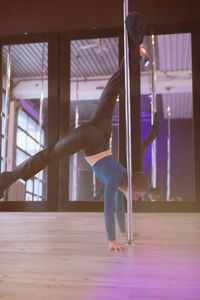 Low section of woman exercising in gym