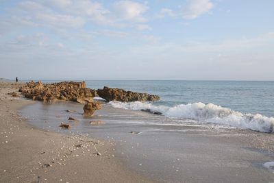 Scenic view of beach against sky