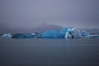 Scenic view of frozen sea against sky