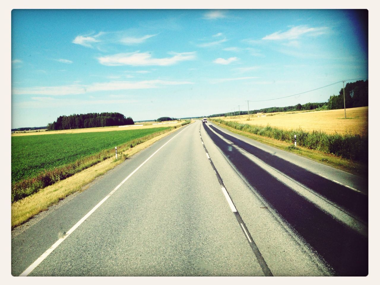 the way forward, transportation, road, diminishing perspective, transfer print, vanishing point, sky, road marking, country road, landscape, auto post production filter, asphalt, tranquil scene, long, empty, field, tranquility, cloud - sky, empty road, cloud