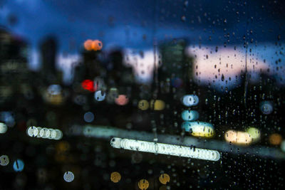 Close-up of wet glass window in rainy season