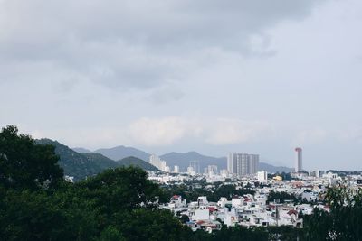 High angle view of buildings in city against sky