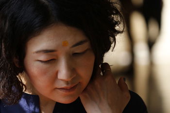 Close-up of mature woman with tikka on her forehead