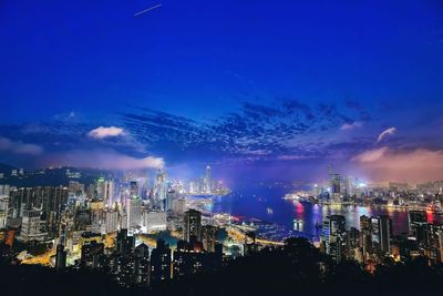 Aerial view of city lit up at night